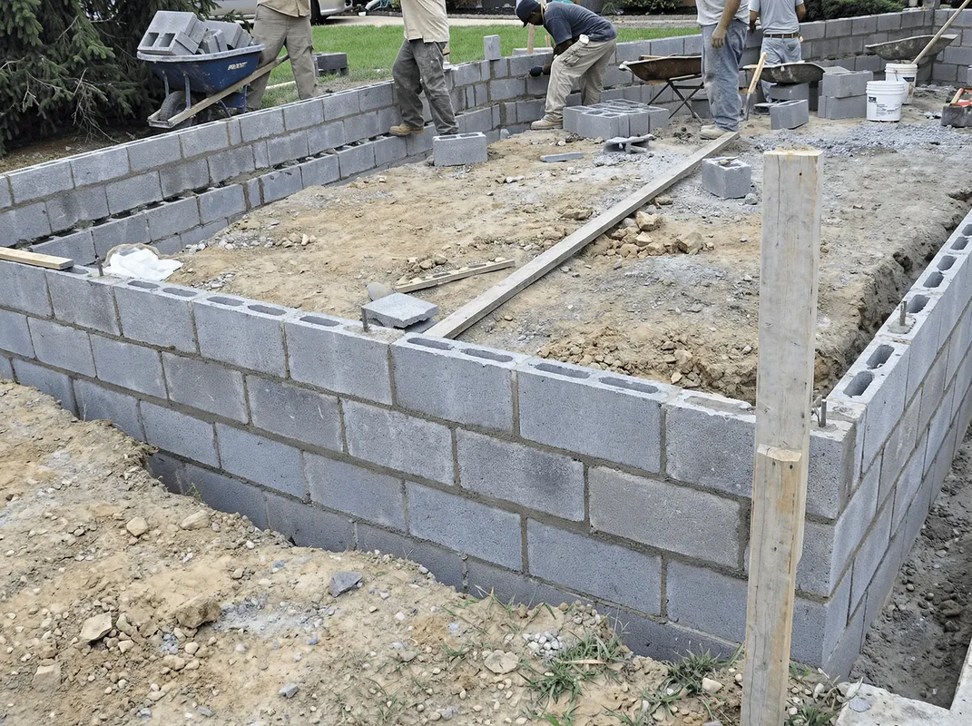 Professionals building a foundation with blocks in Dallas, TX